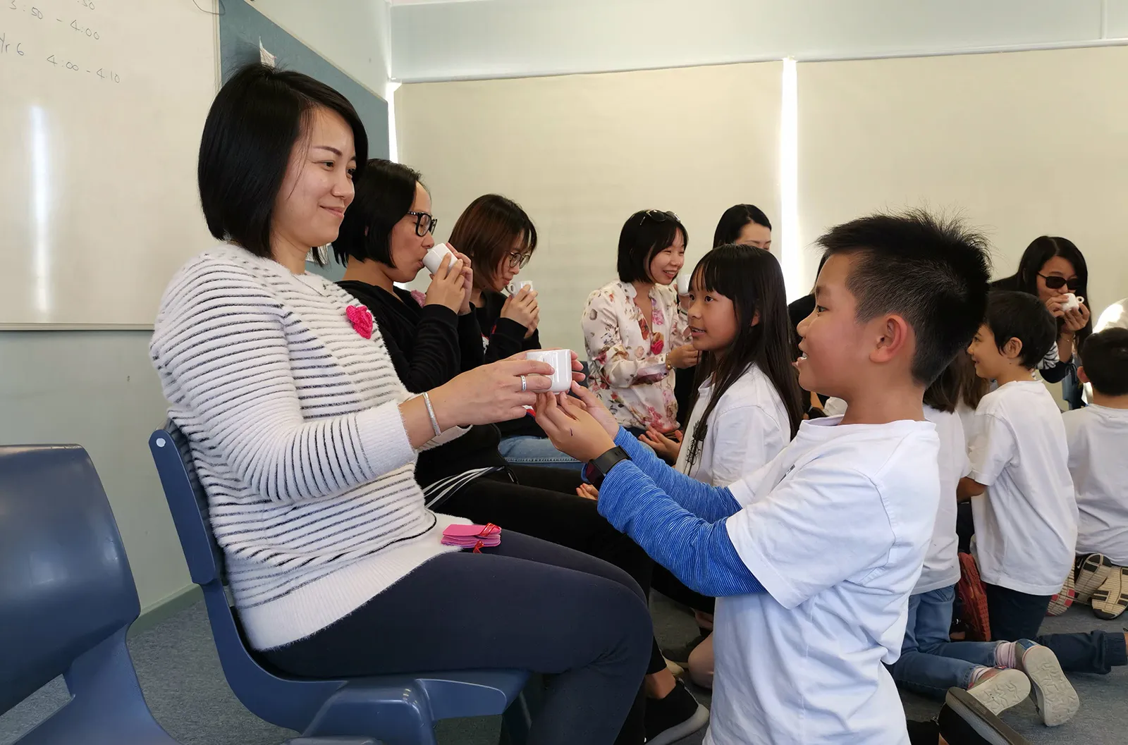 Tzu Chi Academy - Students of the Tzu Chi Academy knelt to offer tea