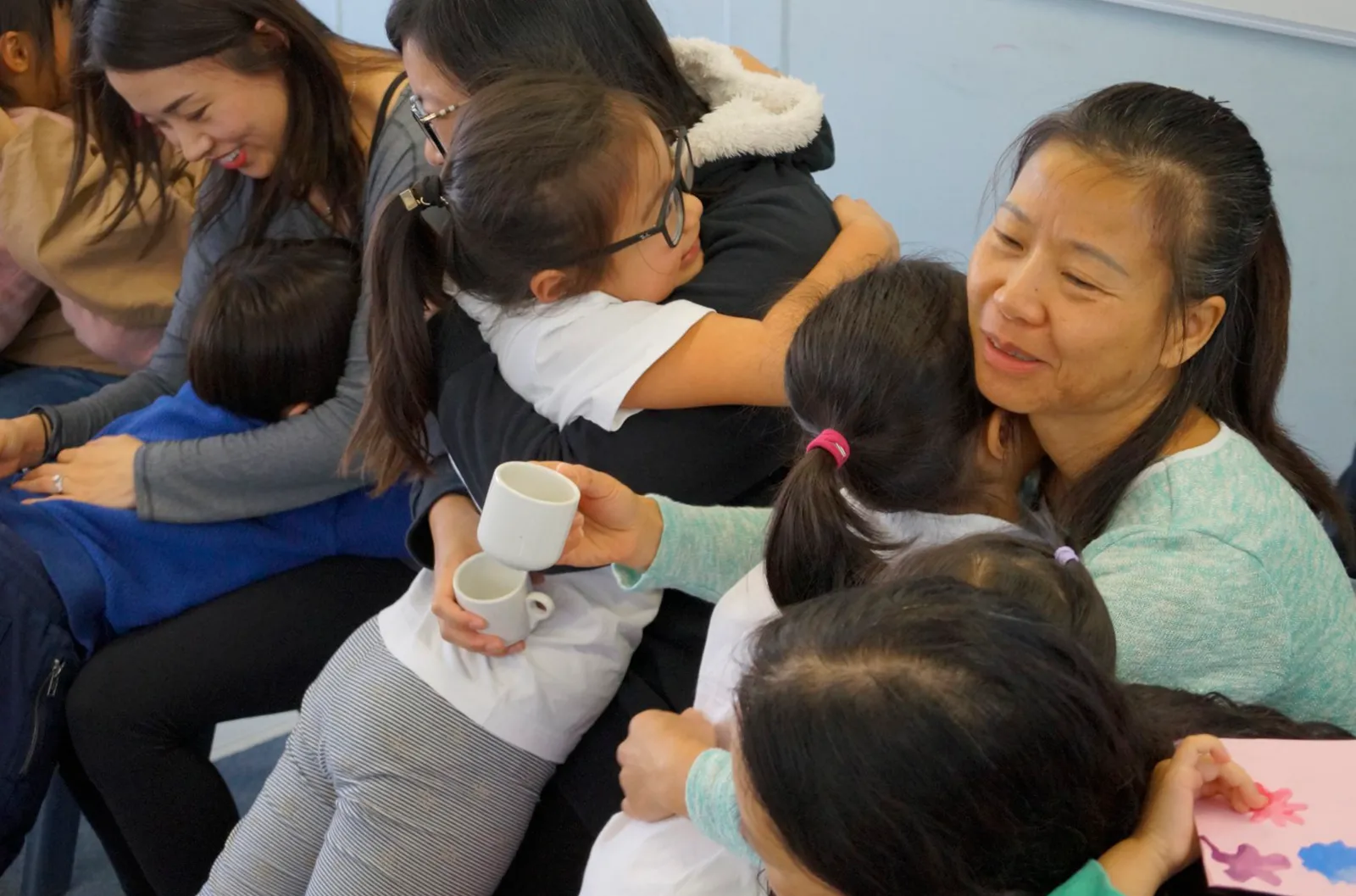 Tzu Chi Academy - After kneeling to offer tea, the Tzu Chi Academy students embraced their mothers